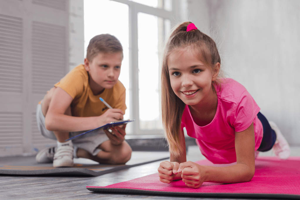 boy-writing-clipboard-while-looking-smiling-girl-exercising.png boy-writing-clipboard-while-looking-smiling-girl-exercising.png
